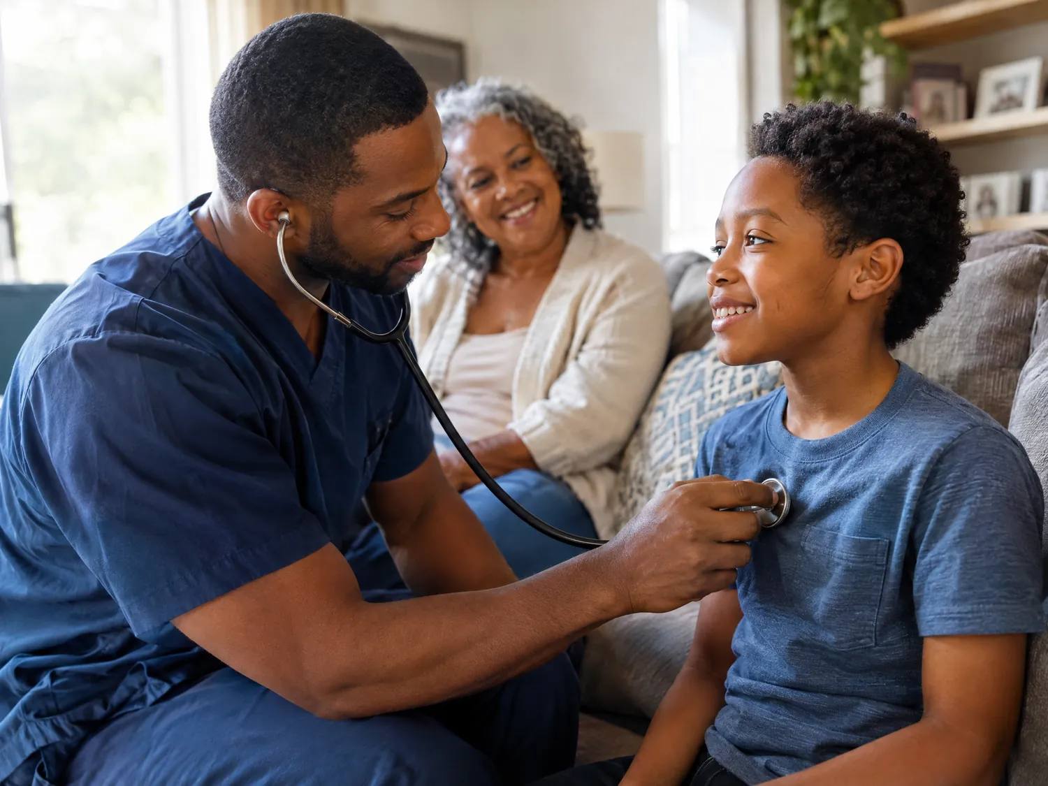 Pediatric nurse listening to a boy’s chest as his grandmother smiles