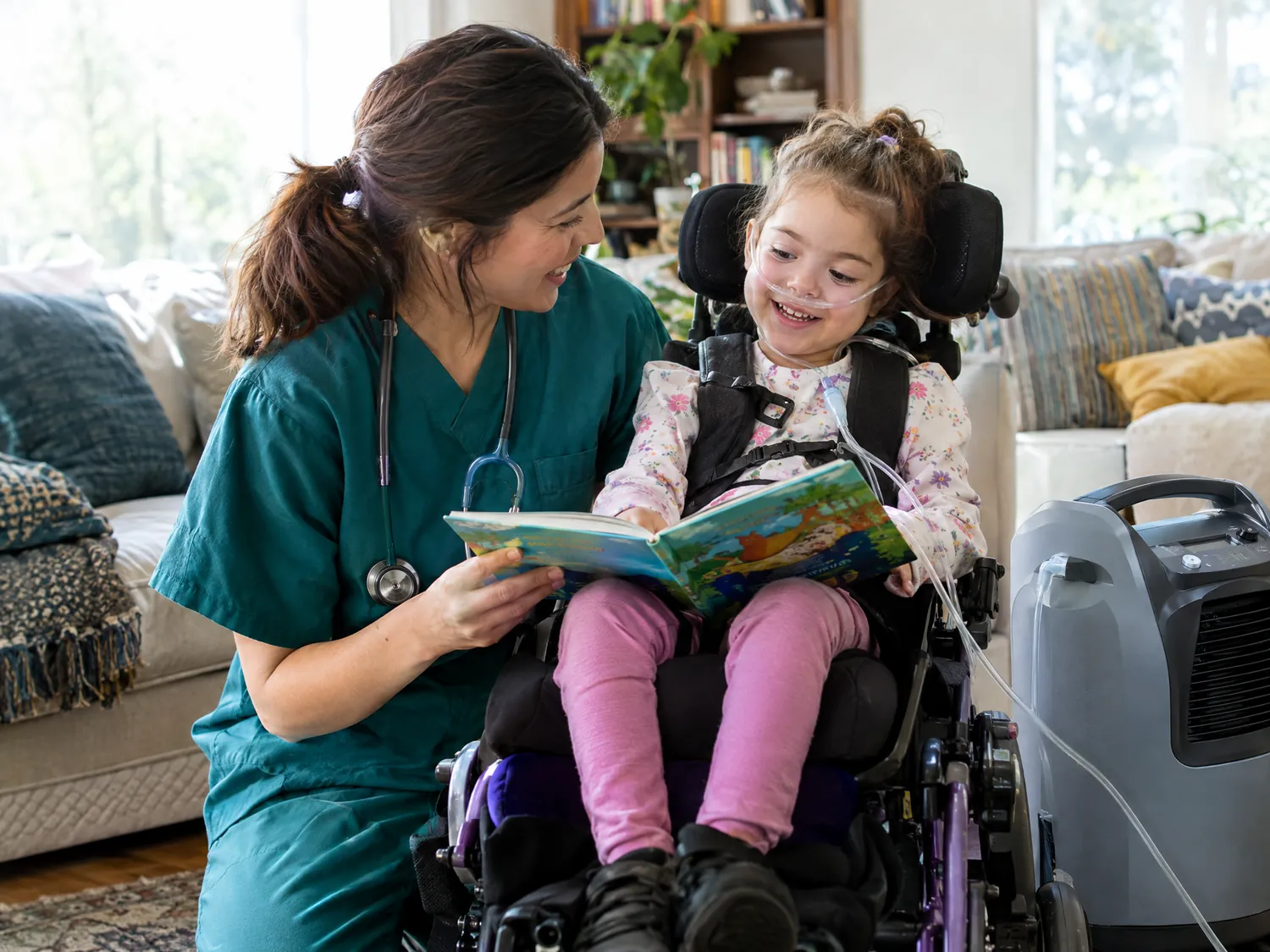 Nurse reading with a girl on oxygen in her medical chair